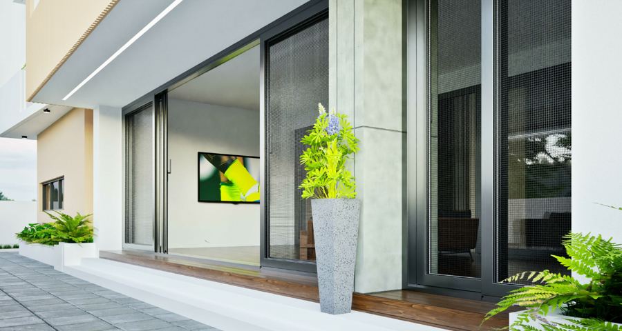 Close-up of the glazed ground-floor living space opening onto the terrace